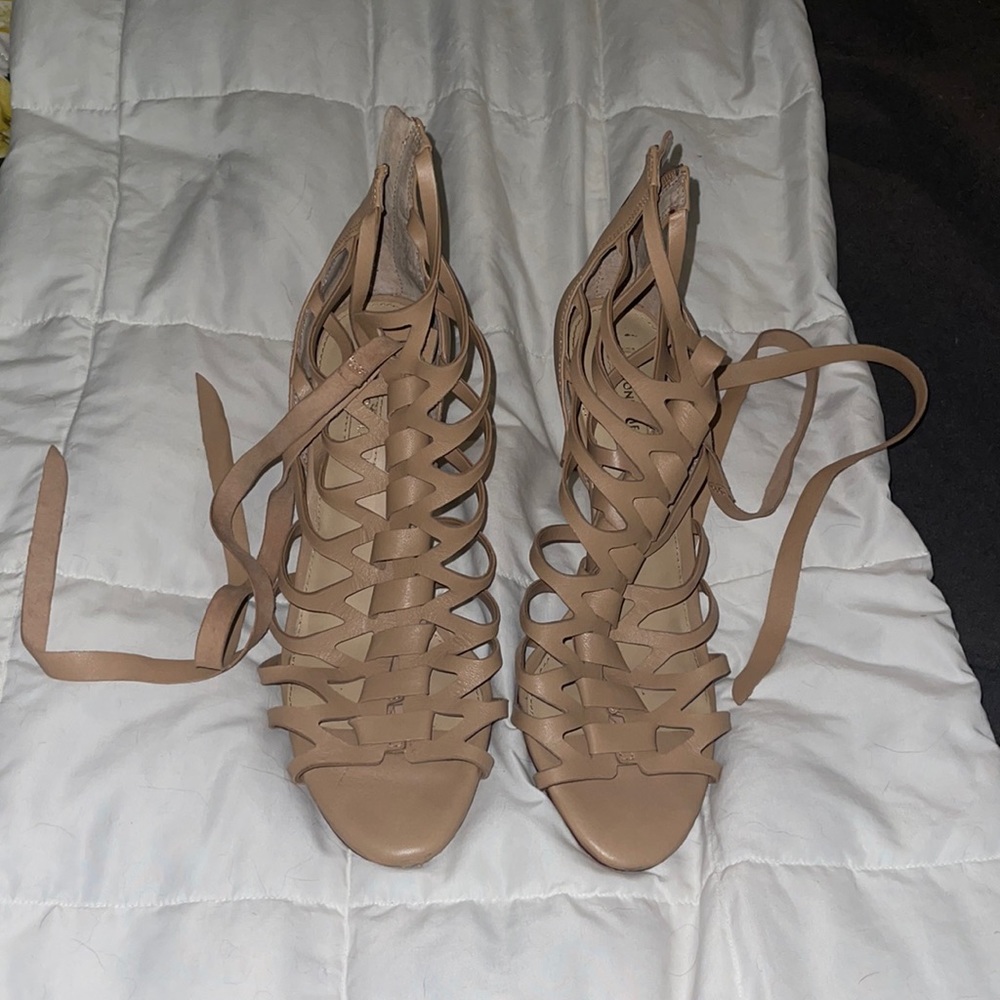 Antonio Melani zippered close with straps around the ankles
